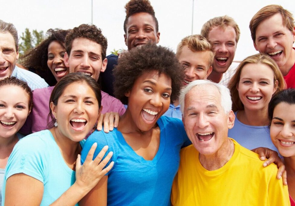 A group of people that are smiling for the camera