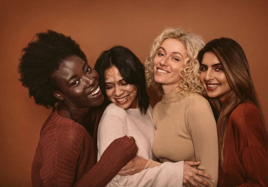 A group of women smiling for the camera.